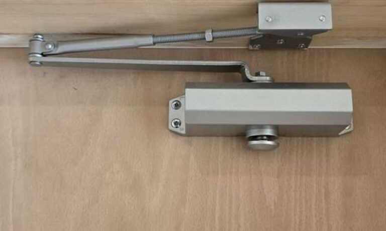 Fire door closer arm checked and adjusted