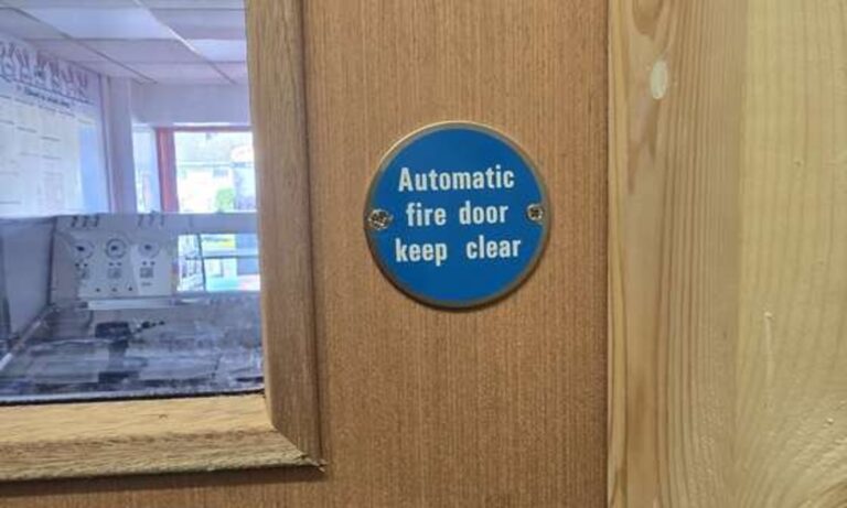 Fire door with vision panel and Automatic Fire Door Keep Clear sign