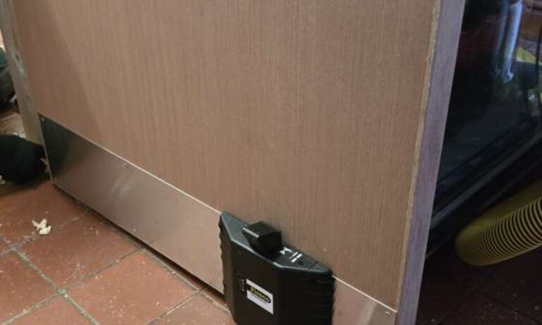 Bottom edge and threshold gap checked on a fire door