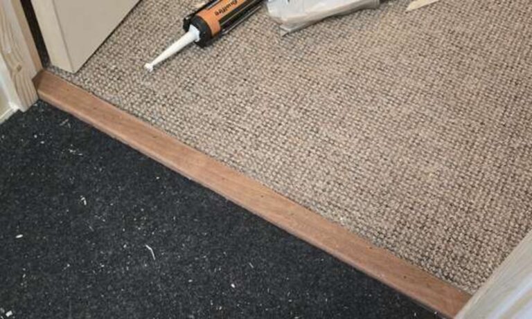 Sealant applied around a fire door frame during maintenance