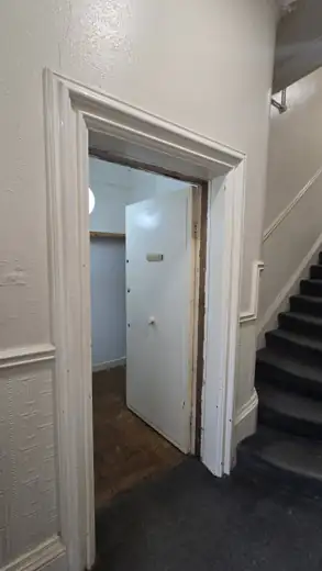 Victorian fire door Liverpool: the original door from the hallway side before replacement