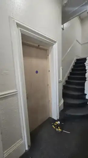 Victorian fire door Liverpool: Finished: the original Victorian architraves refitted around a certified fire door